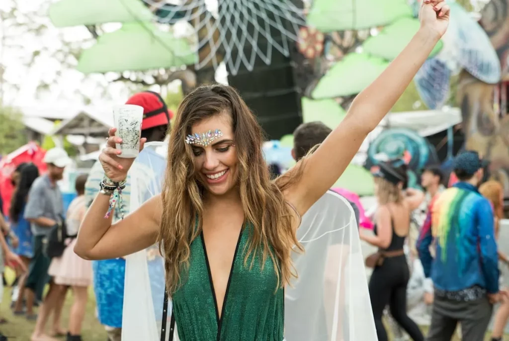 Woman-dancing-and-raising-her-hand-at-outdoor-music-festival-in-Australia.jpg